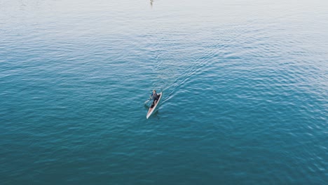 Canoeing-in-the-city-river,-kayaking-in-Seville-in-very-calm-blue-waters