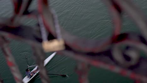 sport-Canoeing-in-the-city-river,-kayaking-in-Seville-in-very-calm-blue-waters