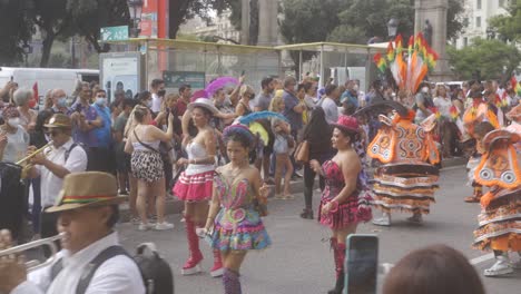 Bolivian-dancing-Parade-in-streets-of-Barcelona,-Spain-on-National-Day-of-Spain