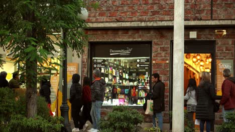 People-walking-in-front-of-Stores-at-Barrio-Italia,-unique-and-historic-Neighborhood-in-Santiago,-Chile