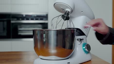 Spotless-bowl-placed-in-tray-of-stand-mixer,-whiskers-tilted-up