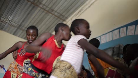 Girls-in-traditional-zambia-african-clothing-dance-and-sing-at-school-assembly