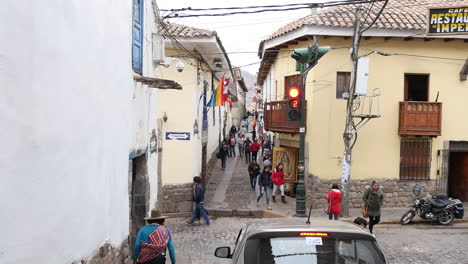 Handheld-shot-of-man-entering-car-near-crosswalk-on-street-in-peru