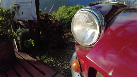 A-dolly-shot-of-an-old-Triumph-motors-vehicle-displayed-on-a-mountain-view-cafe-of-Jomax-Peak-in-Don-Salvador-Benedicto,-Negros-Occidental,-Philippines