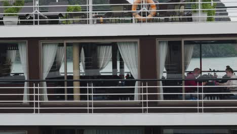 A-close-up-shot-of-the-windows-of-a-cruise-ship-in-Ha-Long-Bay,-Vietnam