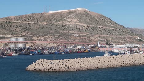 Port-of-Agadir,-Morocco,-North-Africa,-with-fishing-fleet-in-harbour-and-Kasbah-fortress-on-hill-in-the-background