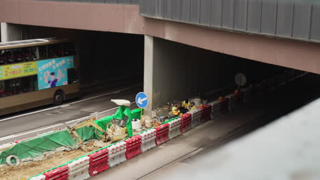 Shot-of-road-construction-project-workers-in-Victoria-city,-Hong-Kong,-China