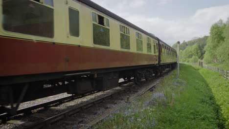 A-train-drawn-by-Steam-engine-slowing-down-as-it-pulls-in-to-Levisham-station-on-the-North-York-Moors-Railway