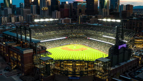 Drone-hyperlapse-at-twilight-of-Rockies-baseball-opening-weekend,-Coors-Field