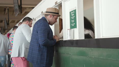 guy-betting-on-horses-at-churchill-downs