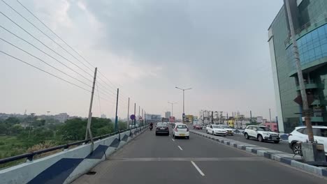 POV-shot-of-Maa-flyover-with-iron-wall-to-prevent-kite-flying-wire-to-hit-bike-riders