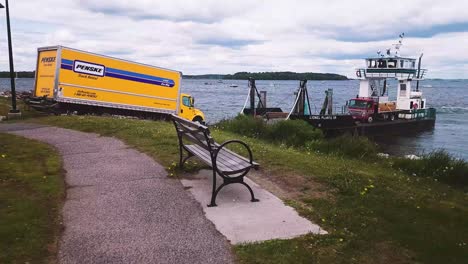 Big-yellow-truck-drives-onto-island-ferry-at-East-End-Beach