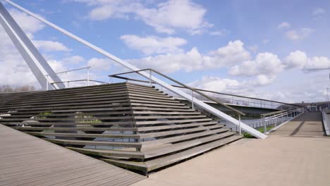 Young-female-student-climbing-down-the-stairs-of-the-Passerelle-La-Belle-Liégeoise