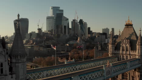 Aerial-shot-over-Tower-bridge-towards-the-Tower-of-London-and-city-skyscrapers