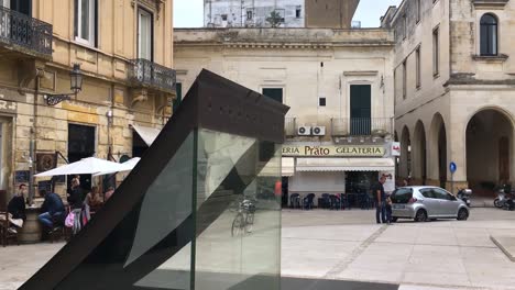 Piazetta-di-Sigismondo-Castromediano-in-Lecce-with-his-statue-and-people-in-the-restaurant-with-panning-motion