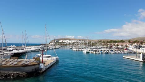 Flying-through-the-entrance-of-a-port-in-Gran-Canaria,-Spain