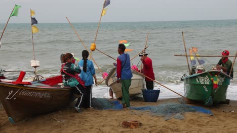 Wind-whips-flags-and-fishermen-talk-as-the-stack-nets-and-prepare-to-return-to-the-sea-for-more-fishing