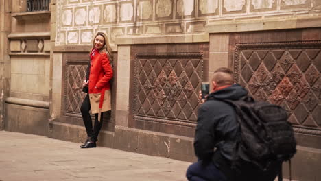 Person-Taking-Photo-of-Girlfriend-in-Gothic-Quarter-in-Barcelona,-Spain