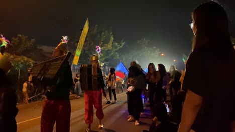 Takbir-parade-or-festival,-an-event-to-welcome-Eid-al-Fitr-or-Eid-al-Adha,-carrying-lanterns-and-wearing-unique-costumes-and-pronouncing-the-symbols-of-Allah