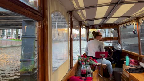 Private-canal-cruise-with-locals'-boat-in-Amsterdam