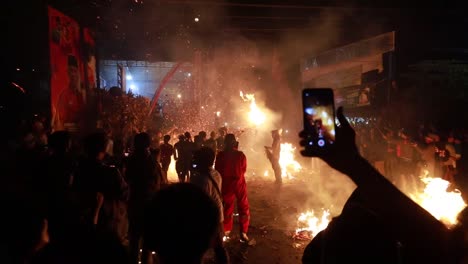 June-5,-2023-:-torch-war,-one-of-the-cultural-heritage-held-after-the-month-of-Ramadan-in-Jepara,-Central-Java,-Indonesia