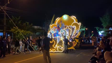 Takbir-parade-or-festival,-an-event-to-welcome-Eid-al-Fitr-or-Eid-al-Adha,-carrying-lanterns-and-wearing-unique-costumes-and-pronouncing-the-symbols-of-Allah