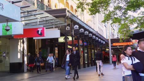 Static-shot-capturing-shoppers-shopping-at-Queen-Street-Mall,-downtown-Brisbane-city,-Australian-retail-giant-Myer-closing-down-its-flagship-department-store-in-the-namesake-shopping-centre