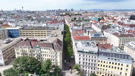 Drone-reveal-horizon-over-buildings-on-riverfront