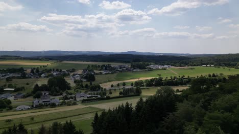 Drone-shot-overview-of-a-the-beautiful-landscape-of-Boos-in-the-Eifel,-Germany