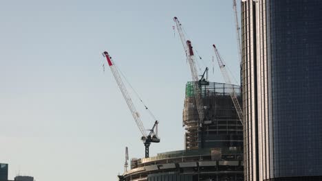 View-of-cranes-on-the-Queens-Wharf-Project,-Brisbane-City,-in-the-afternoon-light,-Queensland,-Australia