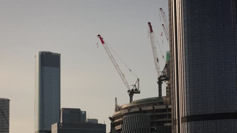 View-of-cranes-on-the-Queens-Wharf-Project,-Brisbane-City,-in-the-afternoon-light,-Queensland,-Australia