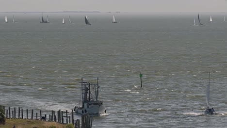 A-fishing-boat-coming-in-from-a-day-of-fishing-in-Galveston-Bay-in-Kemah-Texas