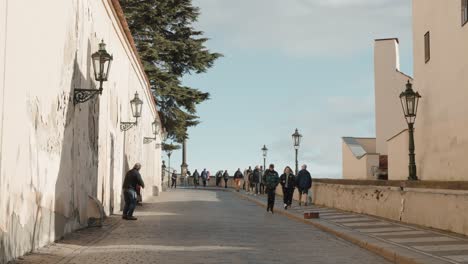 tourists-in-Walking-path-leading-to-historic-castle-in-Prague,-Czech-Republic