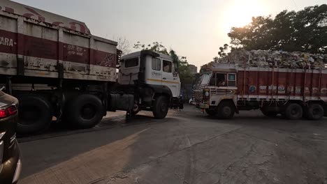 POV-SHOT-Many-trucks-are-lined-up-and-full-of-garbage