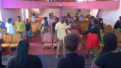 African-local-festival-inside-modern-pink-church