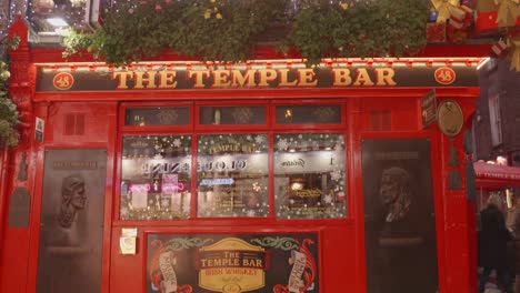 Dublin,-Ireland---People-Strolling-by-Temple-Bar-During-the-Nighttime---Pan-Down-Shot