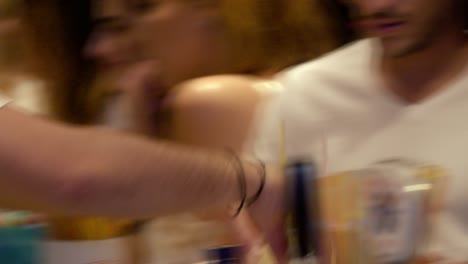 Bartender-Serving-Cocktail-with-Straws-at-Bar