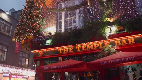 Tilting-shot-of-the-decorated-and-illuminated-front-of-the-Temple-bar-in-Dublin