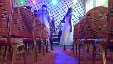 Low-angle-view-of-West-african-man-singing-in-stage-of-a-disco-pub