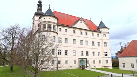 Hartheim-Castle-During-Daytime-In-Alkoven,-Upper-Austria---Drone-Shot