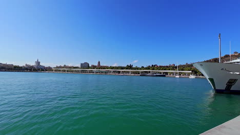 Superyacht-Docked-At-The-Port-Of-Malaga-In-Spain-With-View-Of-Pier-In-Distance