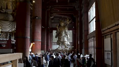 View-Of-Standing-Bishamonten-of-Tōdai-ji-With-Crowds-of-Tourists-Below-On-The-Ground