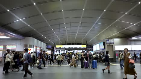 Busy-Scene-With-Commuters-Walking-Past-At-Kyoto-Station