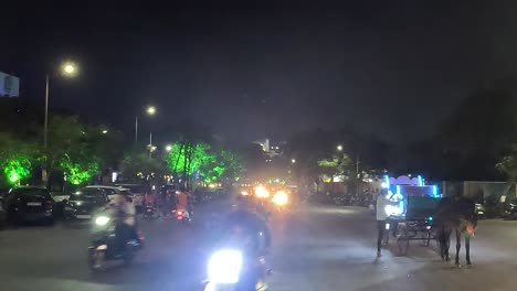 Cinematic-sot,-night-time-people-enjoying-riding-in-twowheels-outside-the-racecourse-ring-road