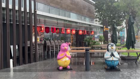 Rainy-day-scene-outside-the-new-Aloft-Hotel-Novena-against-the-background-of-a-Japanese-restaurant-in-Zhongshan-Park,-Singapore