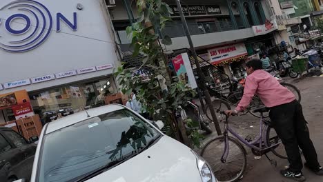 pov-shot-Many-customers-are-going-to-shop-for-TV-fridge-showroom-and-the-fridge-is-loaded-outside