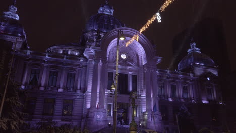 Victory-Avenue-CEC-Palace-illuminated,-winter-time,-Bucharest-Romania