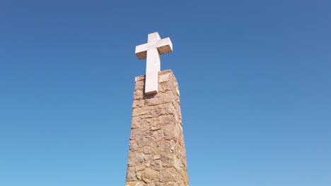 Portugal,-Cabo-da-Roca,-the-religious-landmark-of-the-westernmost-point-of-continental-Europe-with-tourists-around