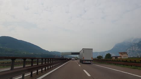 Driving-in-the-region-of-Trentino-Alto-Adige-in-Northern-Italy,-on-a-cloudy-autumn-day