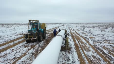 Man-working-at-new-pipeline-construction-welding